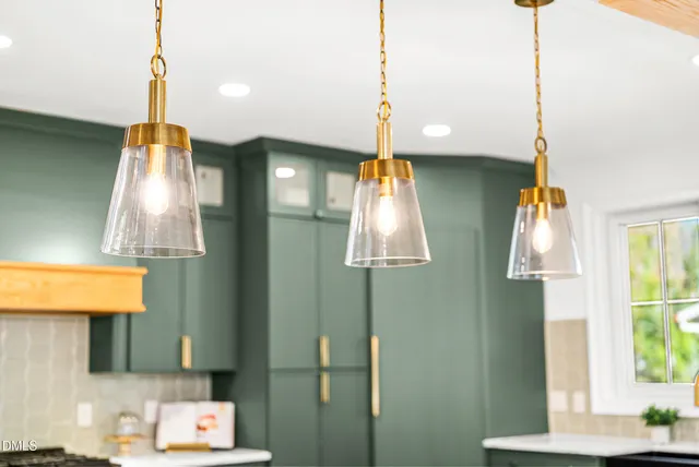a living room with fireplace furniture and a flat screen tv