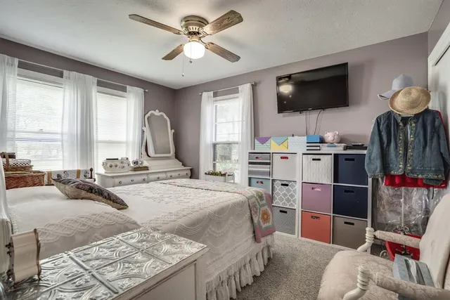 a bedroom with a bed and furniture