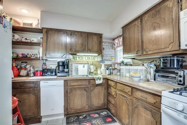 a kitchen with lots of counter top space and appliances