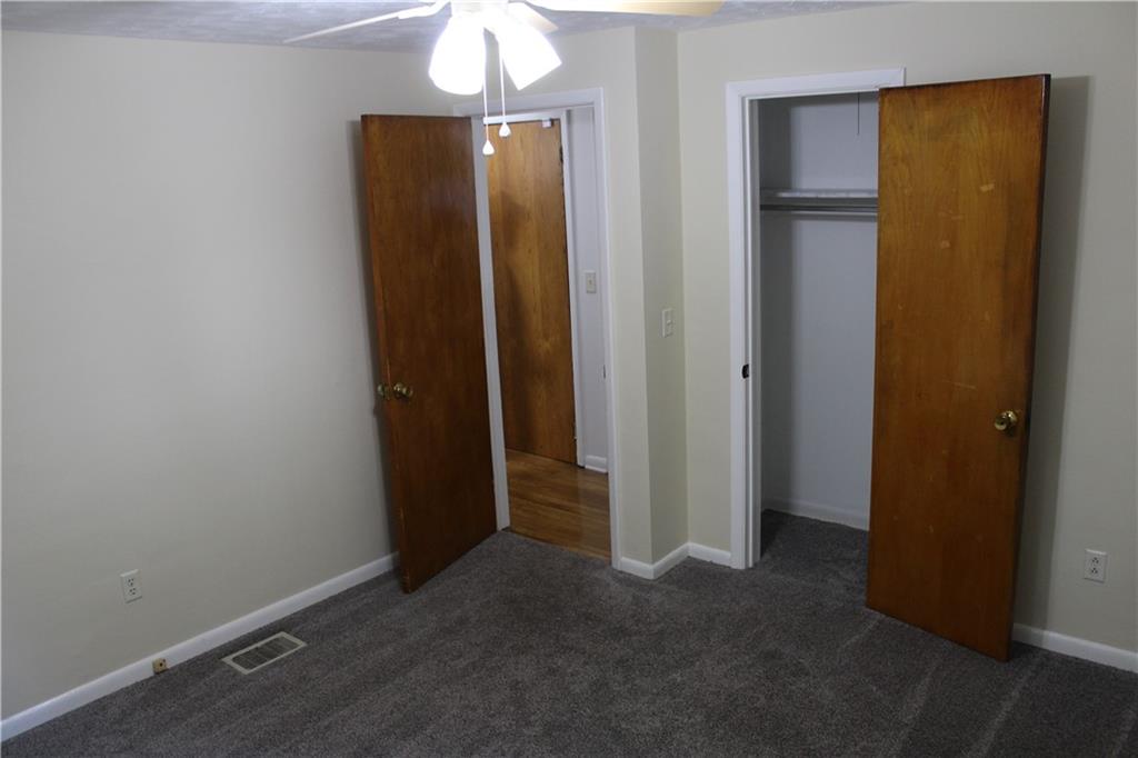 240 State Line Road Burgettstown, PA 15021 - Photo 17 of 42 an empty room with closet and a mirror