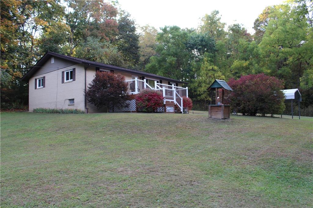 240 State Line Road Burgettstown, PA 15021 - Photo 2 of 42 a view of a house with backyard and trees