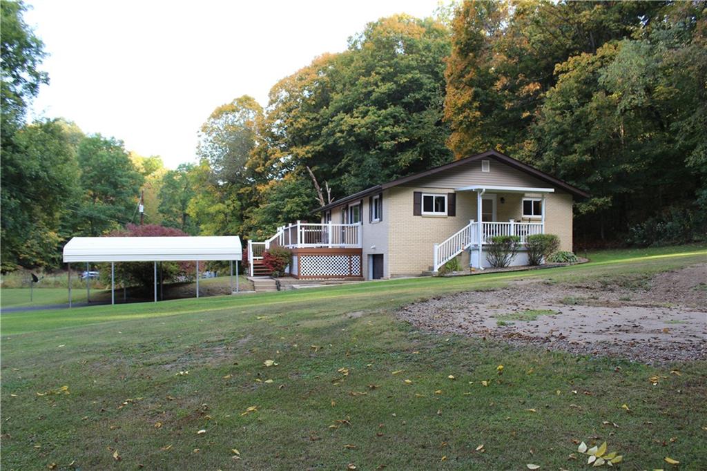 240 State Line Road Burgettstown, PA 15021 - Photo 31 of 42 a front view of a house with garden