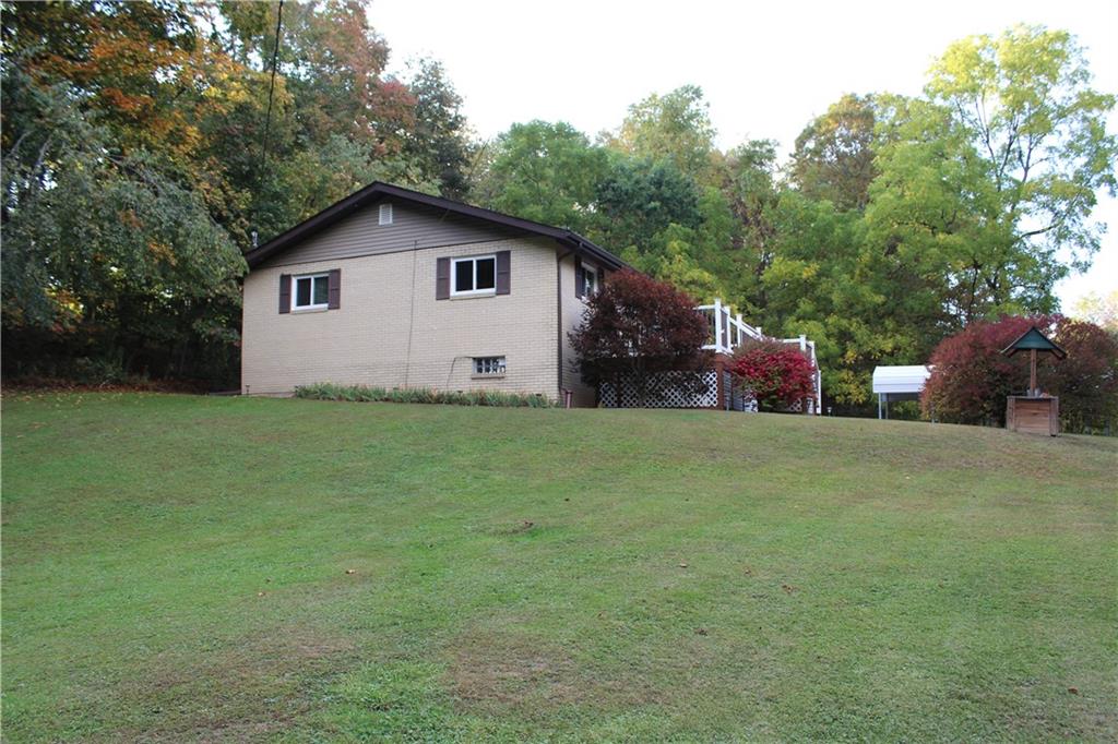 240 State Line Road Burgettstown, PA 15021 - Photo 32 of 42 a view of backyard with outdoor seating and green space
