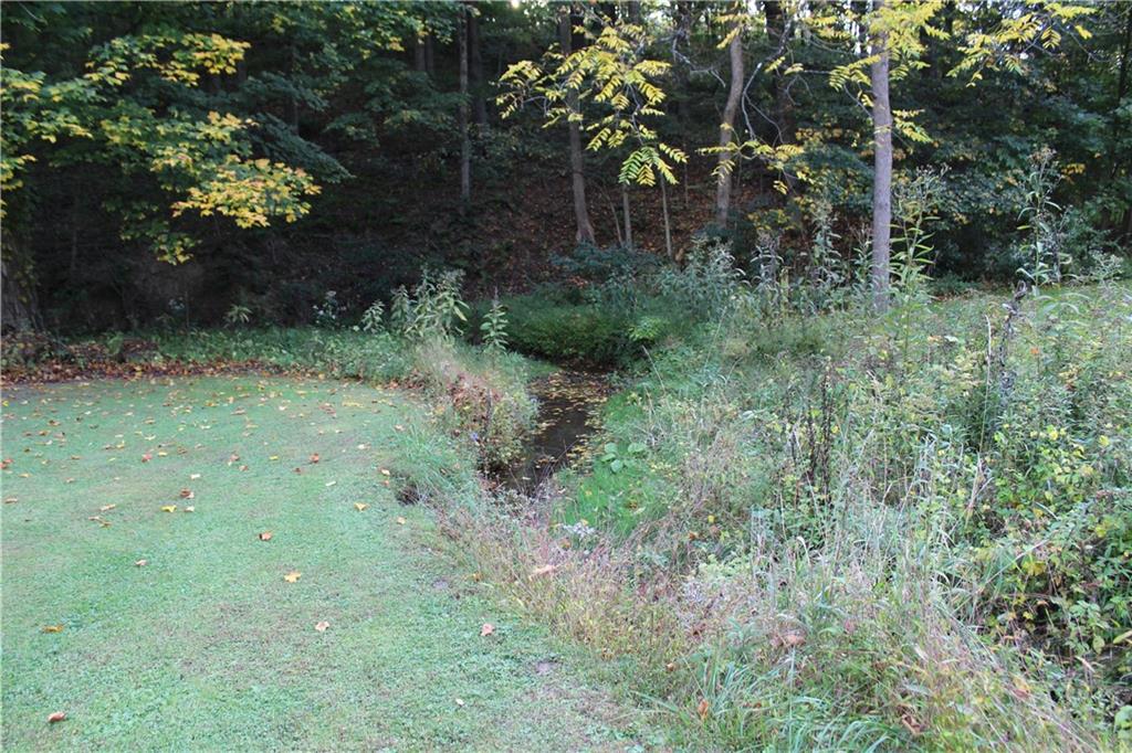 240 State Line Road Burgettstown, PA 15021 - Photo 35 of 42 a backyard of a house with lots of green space