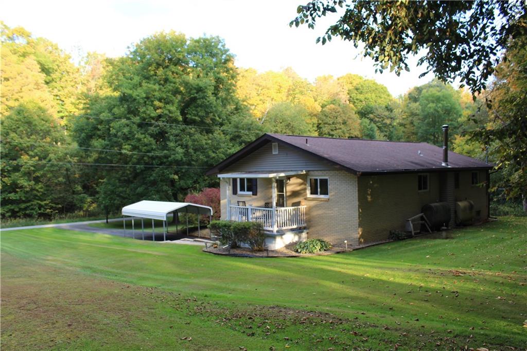 240 State Line Road Burgettstown, PA 15021 - Photo 40 of 42 a front view of a house with garden