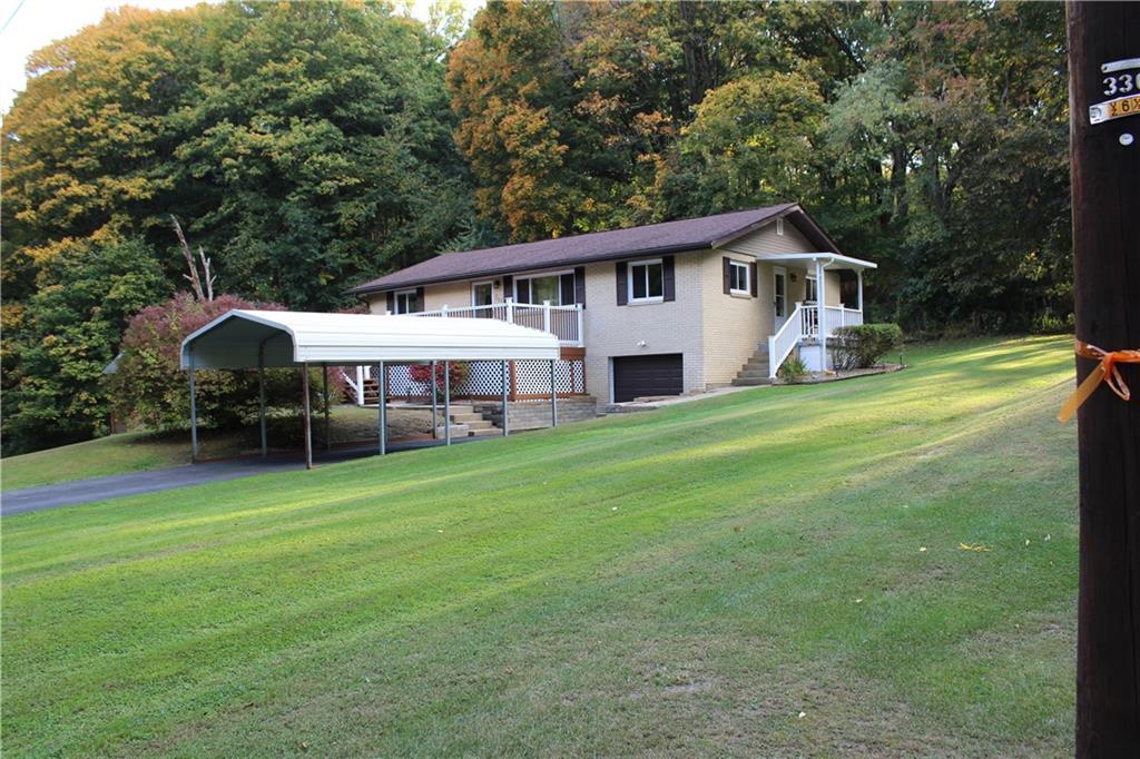 240 State Line Road Burgettstown, PA 15021 - Photo 4 of 42 a front view of a house with garden