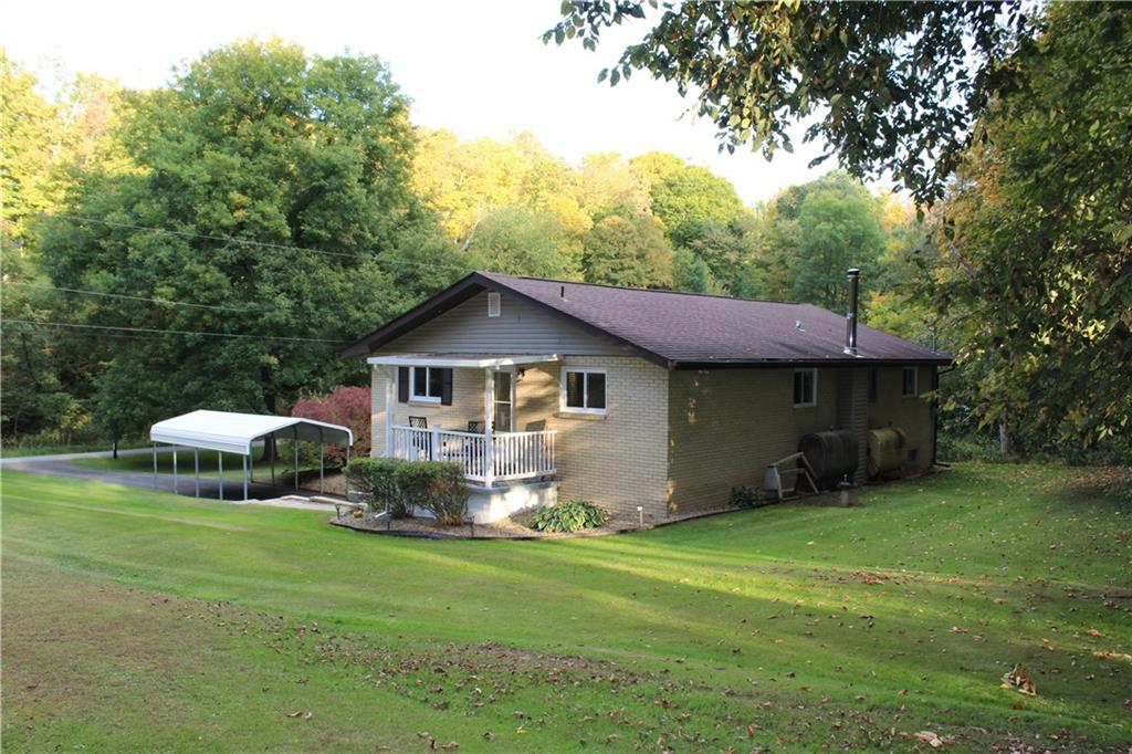 240 State Line Road Burgettstown, PA 15021 - Photo 41 of 42 a front view of a house with garden