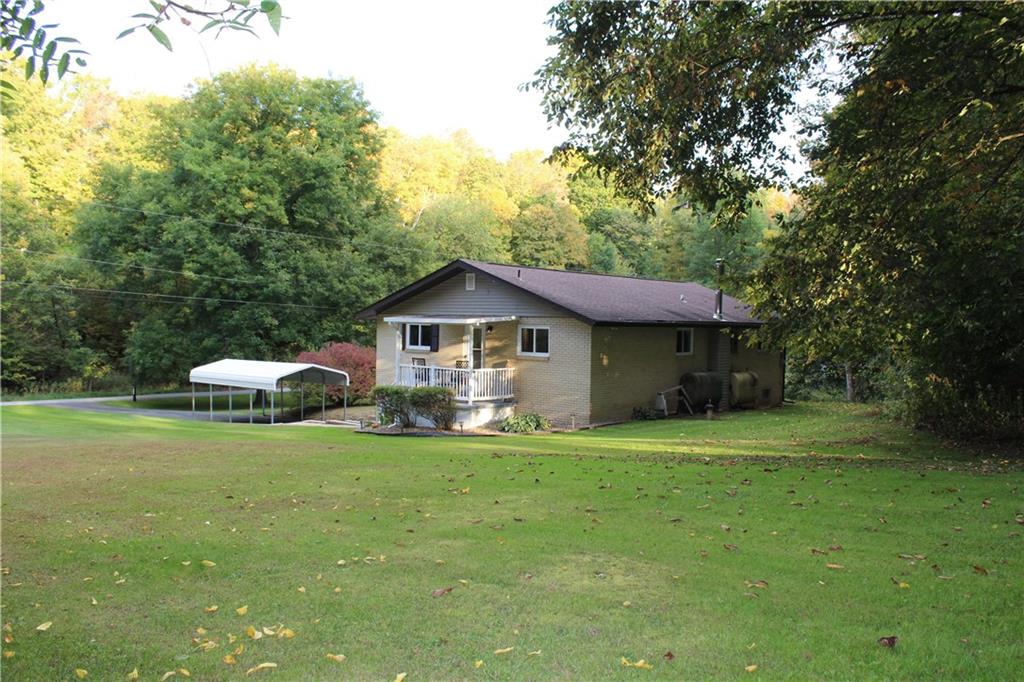 240 State Line Road Burgettstown, PA 15021 - Photo 42 of 42 a front view of a house with a garden