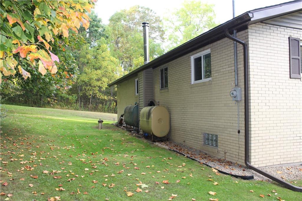240 State Line Road Burgettstown, PA 15021 - Photo 6 of 42 a backyard of a house with table and chairs