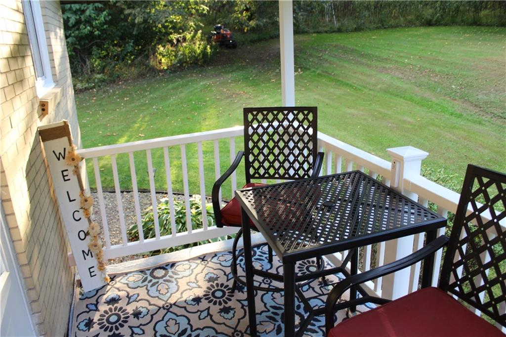 240 State Line Road Burgettstown, PA 15021 - Photo 7 of 42 a view of a balcony with two chairs