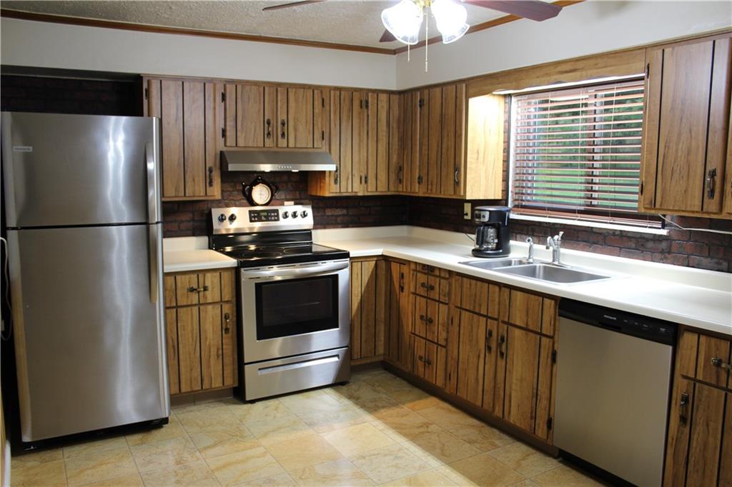 240 State Line Road Burgettstown, PA 15021 - Photo 8 of 42 a kitchen with a refrigerator stove and sink