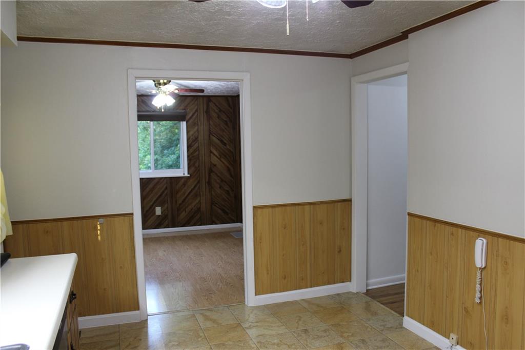 240 State Line Road Burgettstown, PA 15021 - Photo 9 of 42 a view of a hallway with furniture and a window