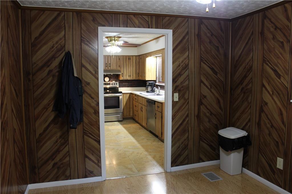 240 State Line Road Burgettstown, PA 15021 - Photo 10 of 42 a kitchen with stainless steel appliances granite countertop a refrigerator a stove and a sink