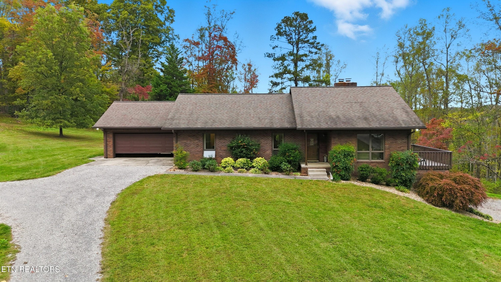 122 Fox Hunter Road Maynardville, TN 37807 - Photo 1 of 60 a view of a house with table and chairs under an umbrella