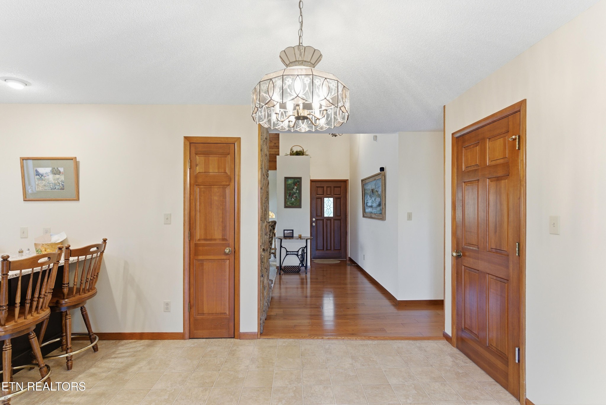 122 Fox Hunter Road Maynardville, TN 37807 - Photo 13 of 60 a view of a livingroom with wooden floor and a chandelier
