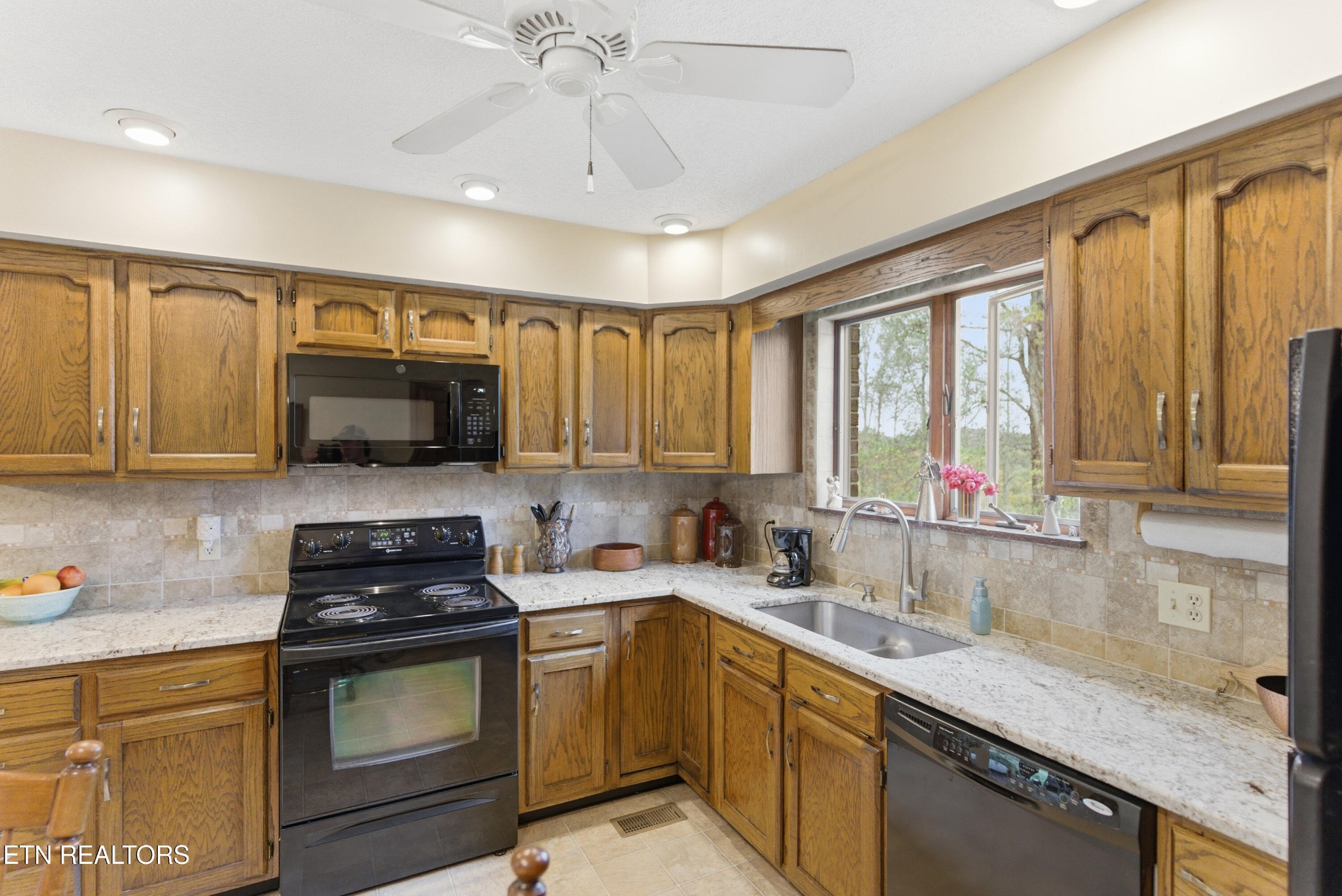 122 Fox Hunter Road Maynardville, TN 37807 - Photo 17 of 60 a kitchen with a sink a stove and cabinets