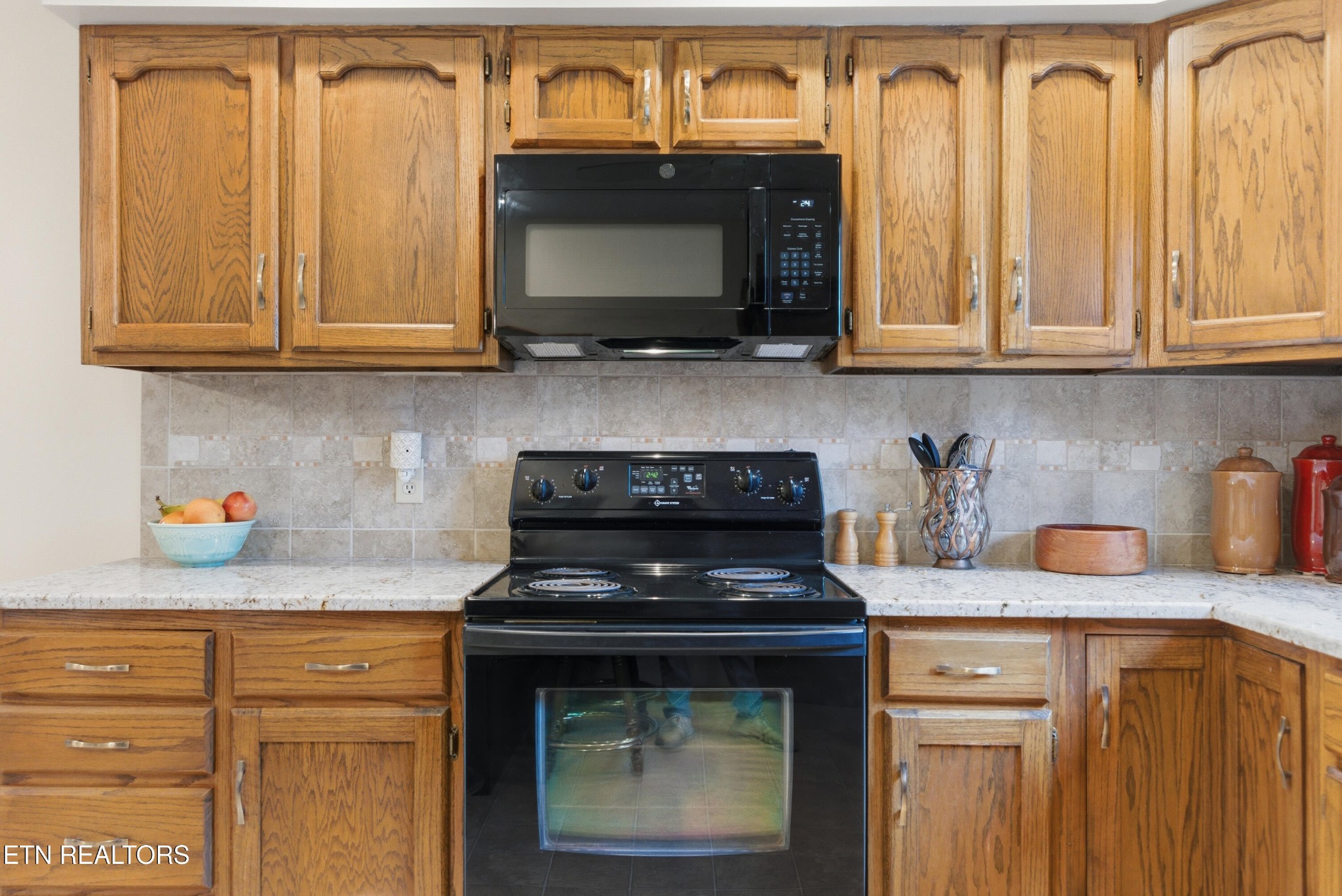 122 Fox Hunter Road Maynardville, TN 37807 - Photo 18 of 60 a kitchen with stainless steel appliances granite countertop white cabinets and a stove top oven