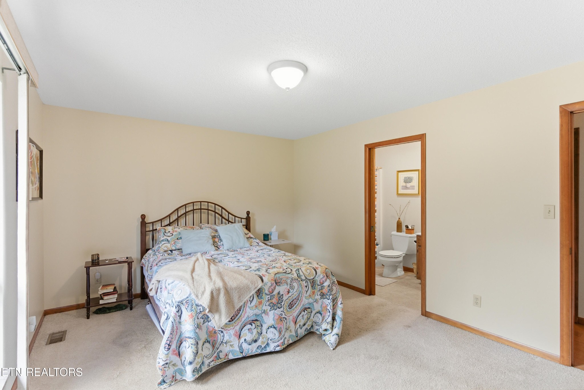 122 Fox Hunter Road Maynardville, TN 37807 - Photo 25 of 60 a bedroom with a bed and a table in it