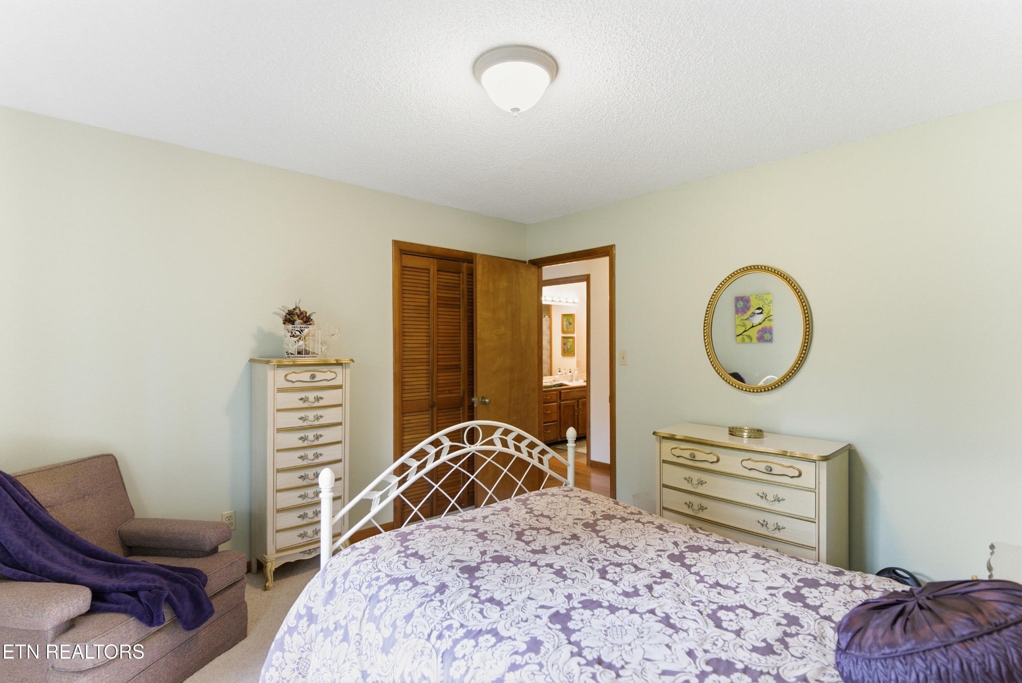 122 Fox Hunter Road Maynardville, TN 37807 - Photo 29 of 60 a bedroom with a bed next to a window with chair