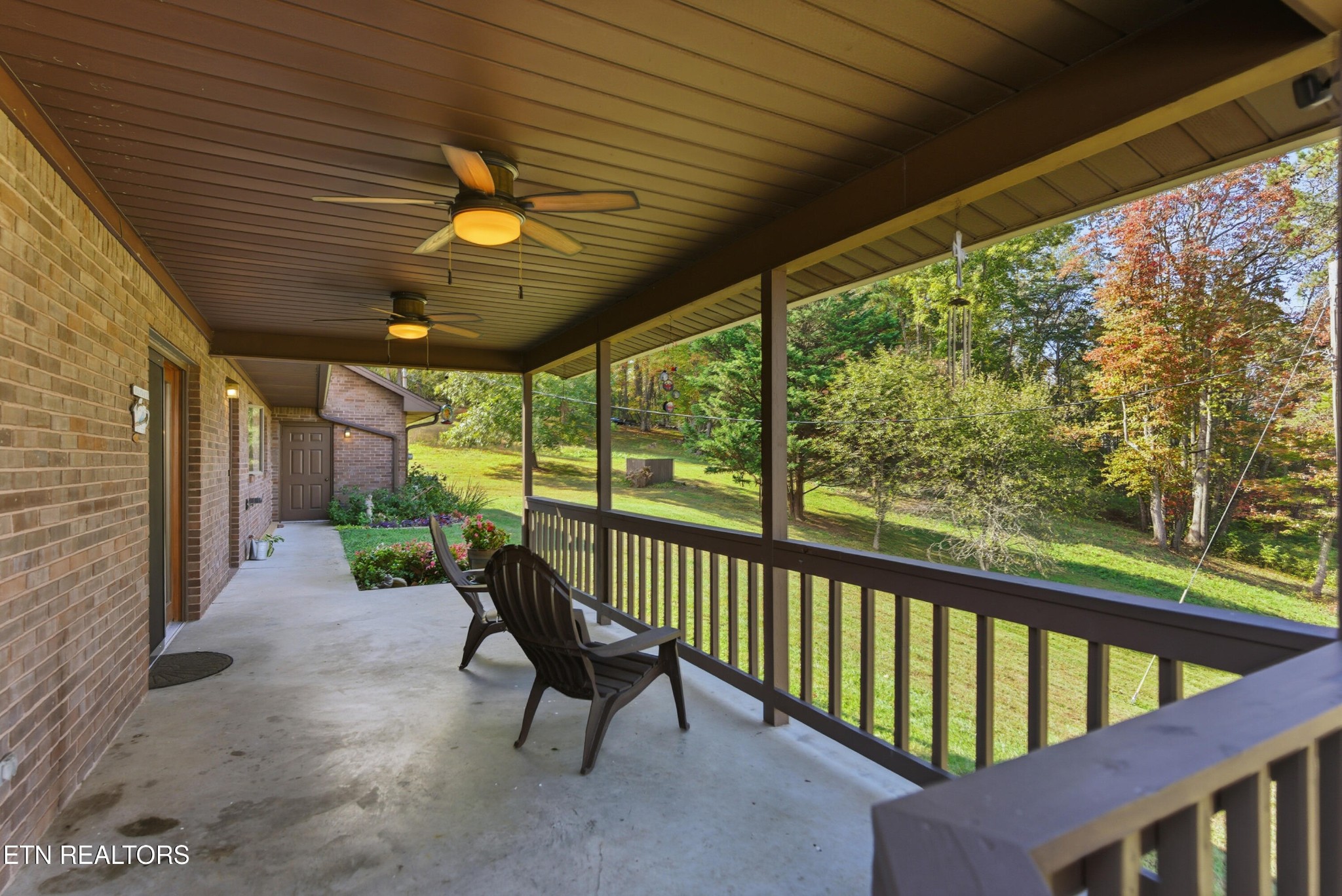 122 Fox Hunter Road Maynardville, TN 37807 - Photo 52 of 60 a view of a porch with furniture and a yard