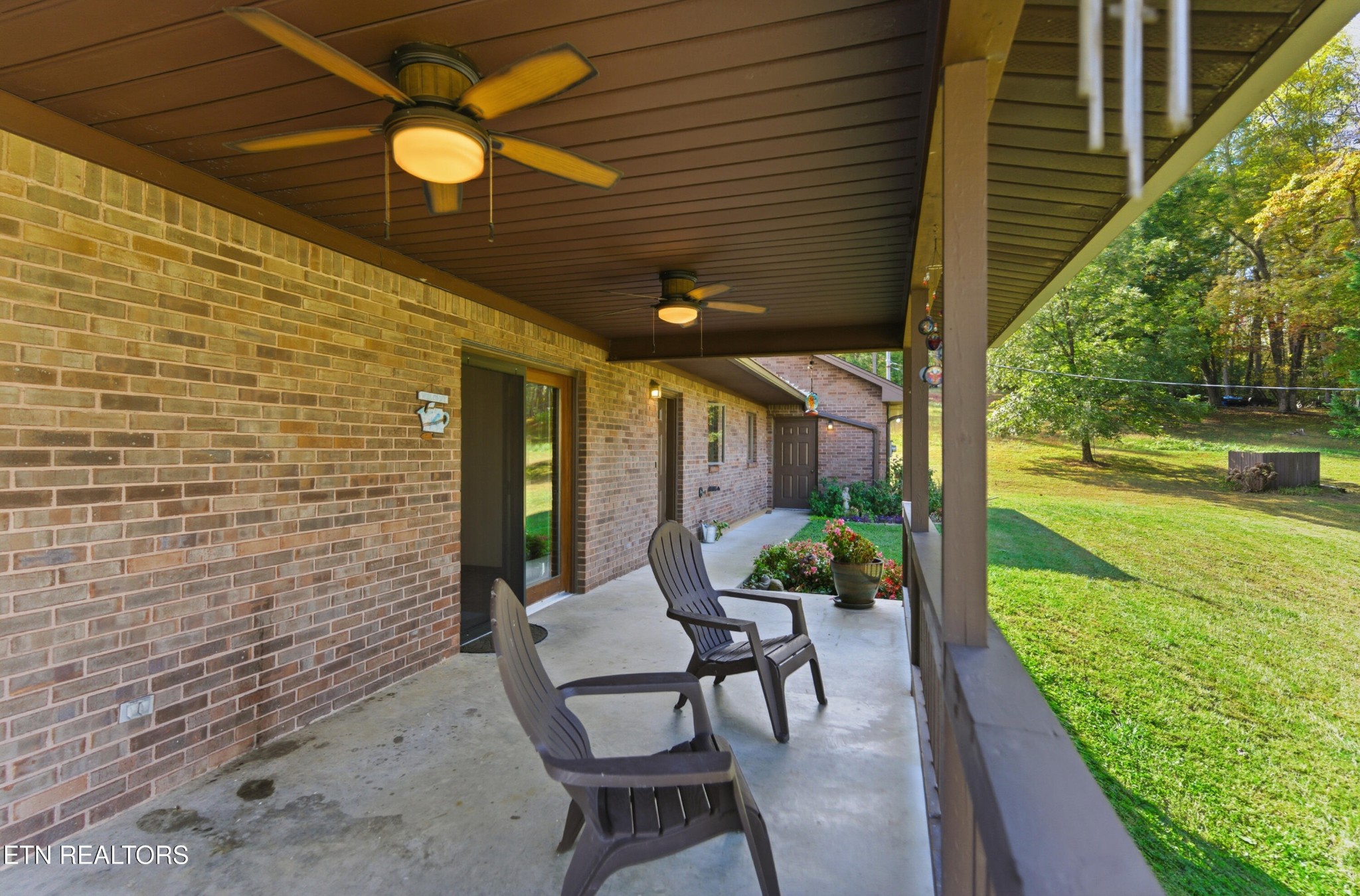 122 Fox Hunter Road Maynardville, TN 37807 - Photo 54 of 60 a view of a patio with table and chairs and potted plants