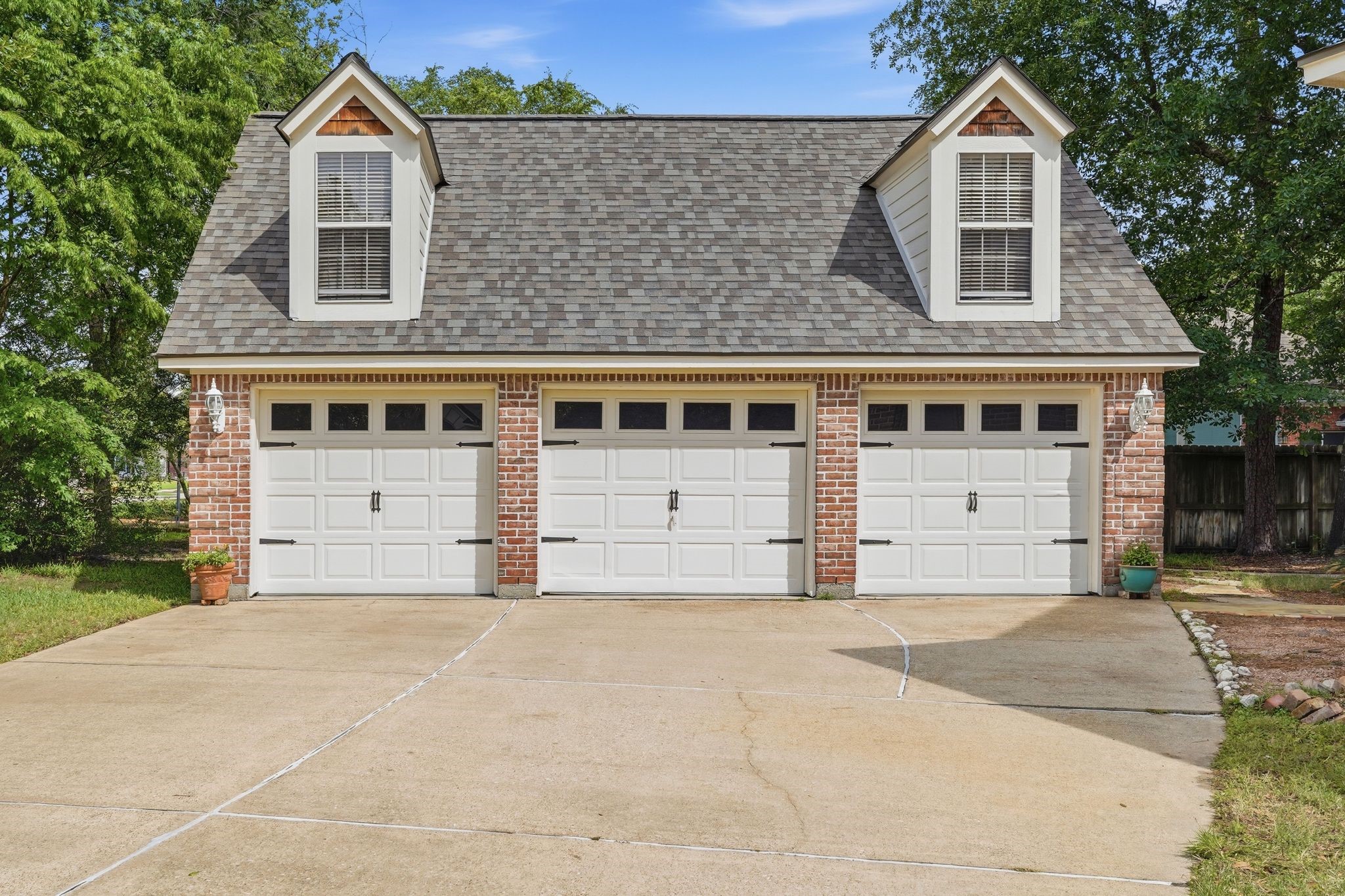 25014 Northampton Terrace Drive Spring, TX 77389 - Photo 3 of 41 Detached 3 car garage provides space for cars, or add a golf cart to ride around to the many community amenities and the private Willow Creek Golf Club which is nearby.