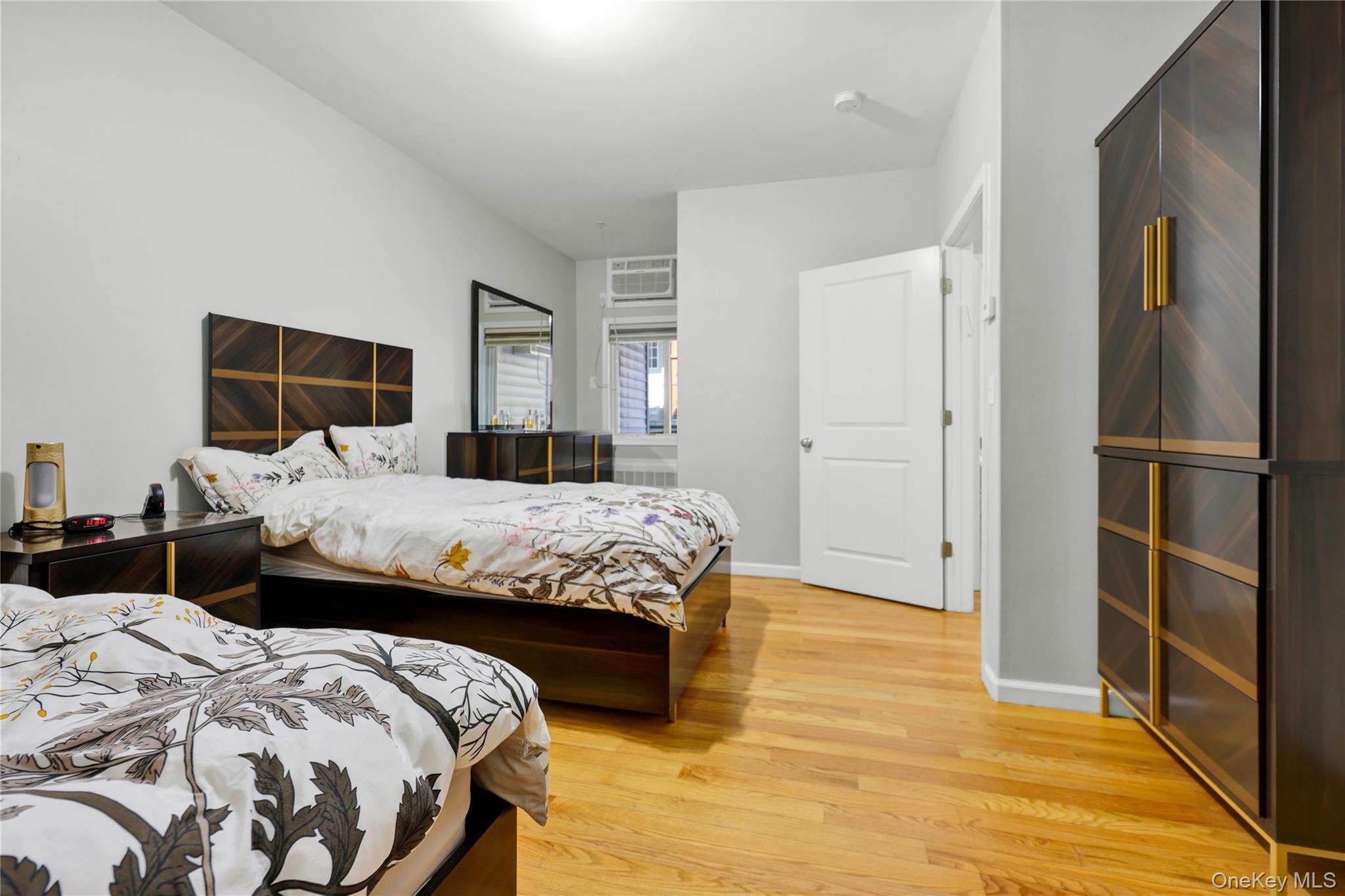 462 West Central Avenue, Unit 120 Spring Valley, NY 10977 - Photo 11 of 21 a bedroom with a bed and a large mirror