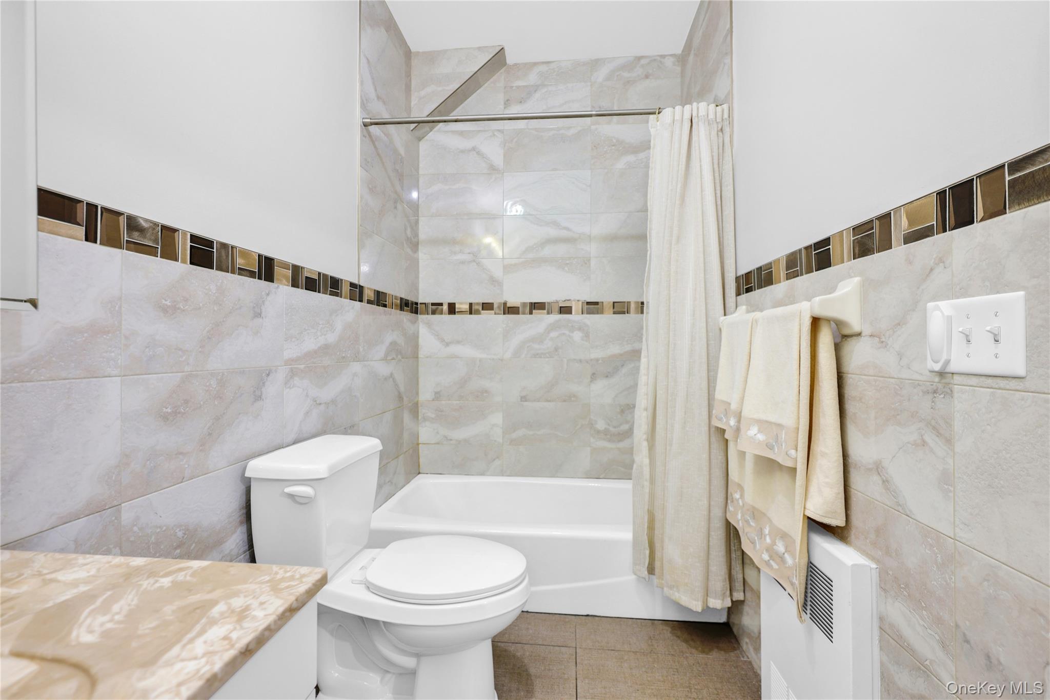 462 West Central Avenue, Unit 120 Spring Valley, NY 10977 - Photo 14 of 21 a bathroom with a bathtub and a toilet