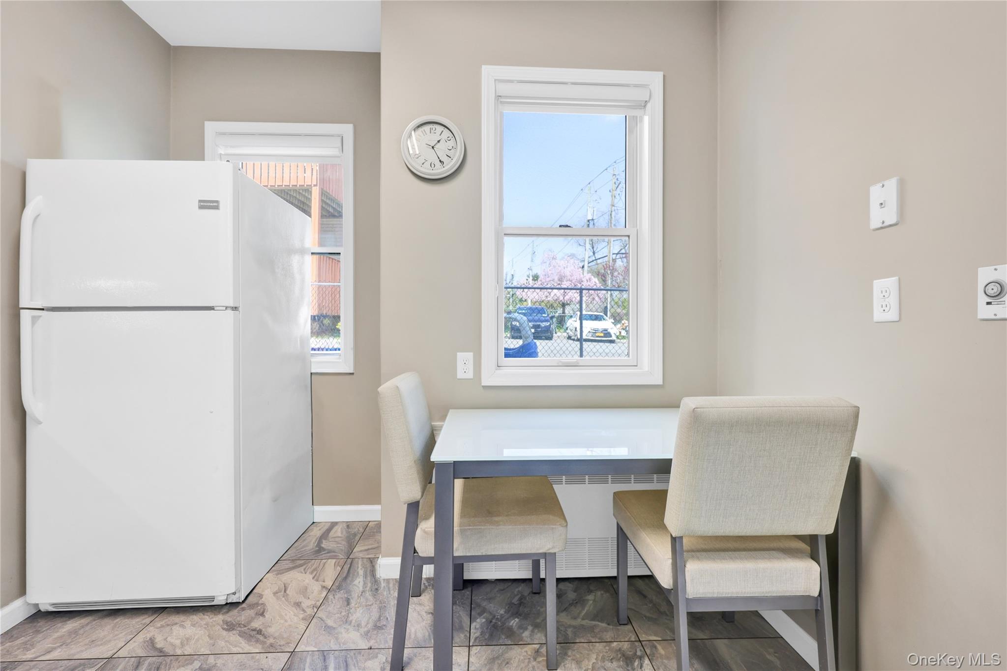 462 West Central Avenue, Unit 120 Spring Valley, NY 10977 - Photo 6 of 21 a chair and a table in a kitchen