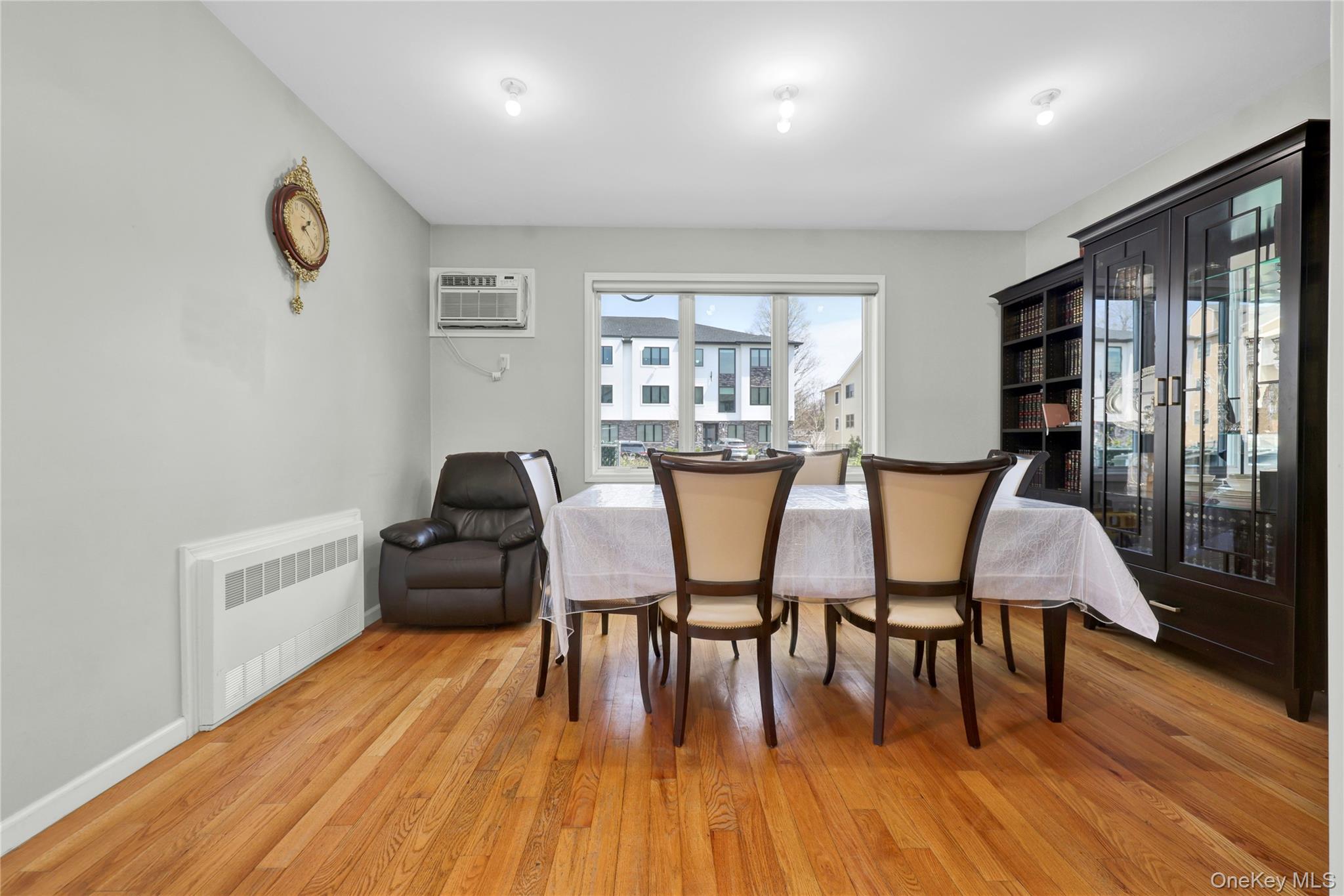 462 West Central Avenue, Unit 120 Spring Valley, NY 10977 - Photo 7 of 21 a view of a dining room with furniture and wooden floor