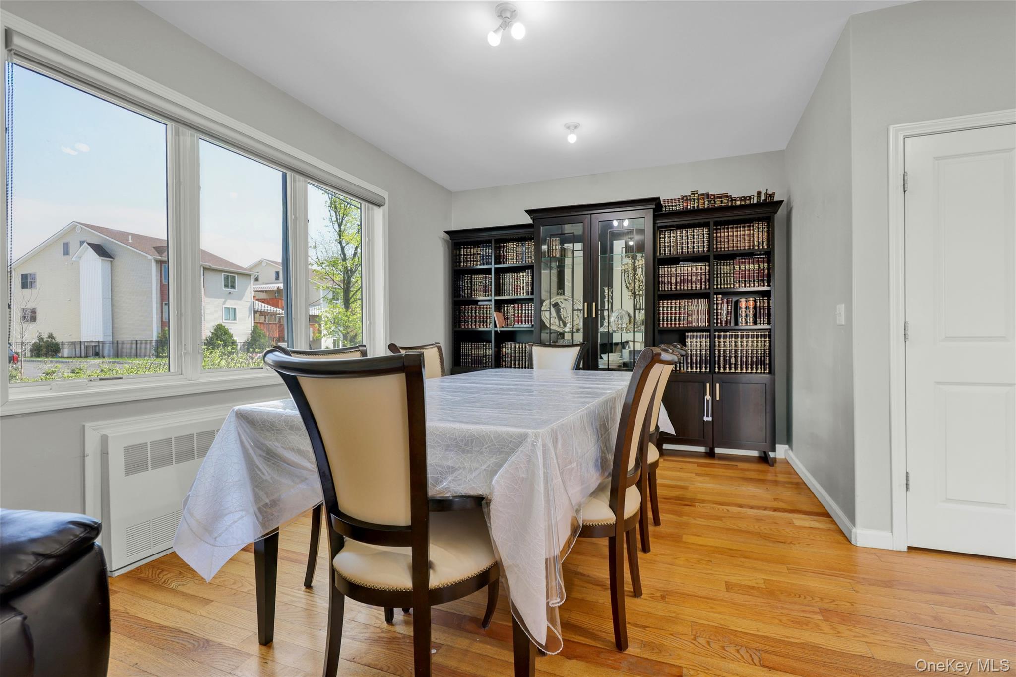 462 West Central Avenue, Unit 120 Spring Valley, NY 10977 - Photo 9 of 21 a dining room with furniture and wooden floor