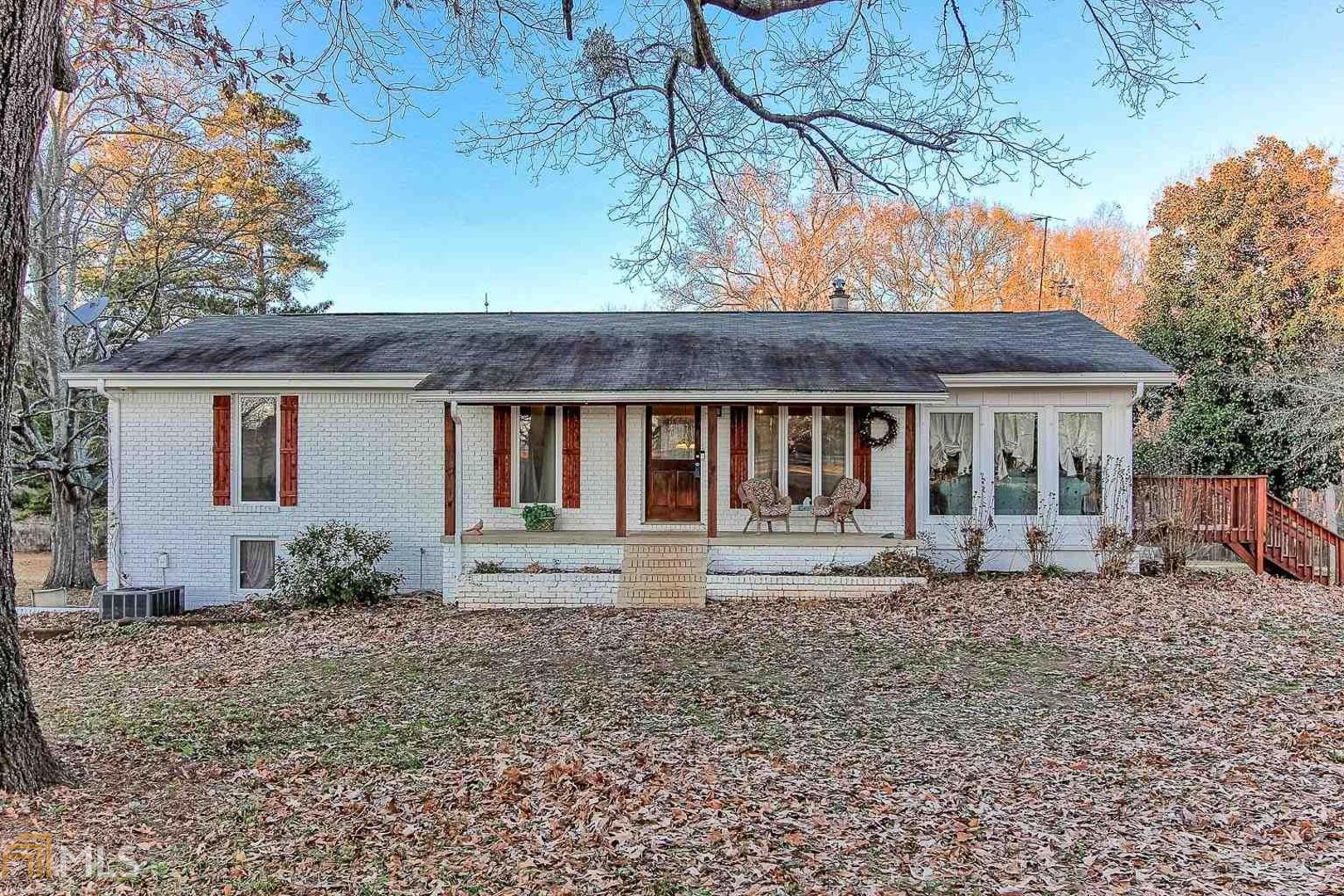 1507 Peeksville Road Locust Grove, GA 30248 - Photo 1 of 1 a front view of a house with garden