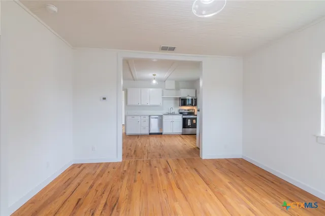 a view of kitchen with wooden floor