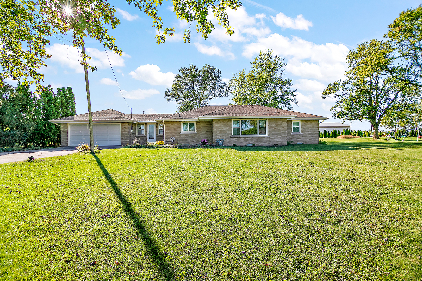 76 South 7000W Road Kankakee, IL 60901 - Photo 1 of 18 a view of a house with a big yard