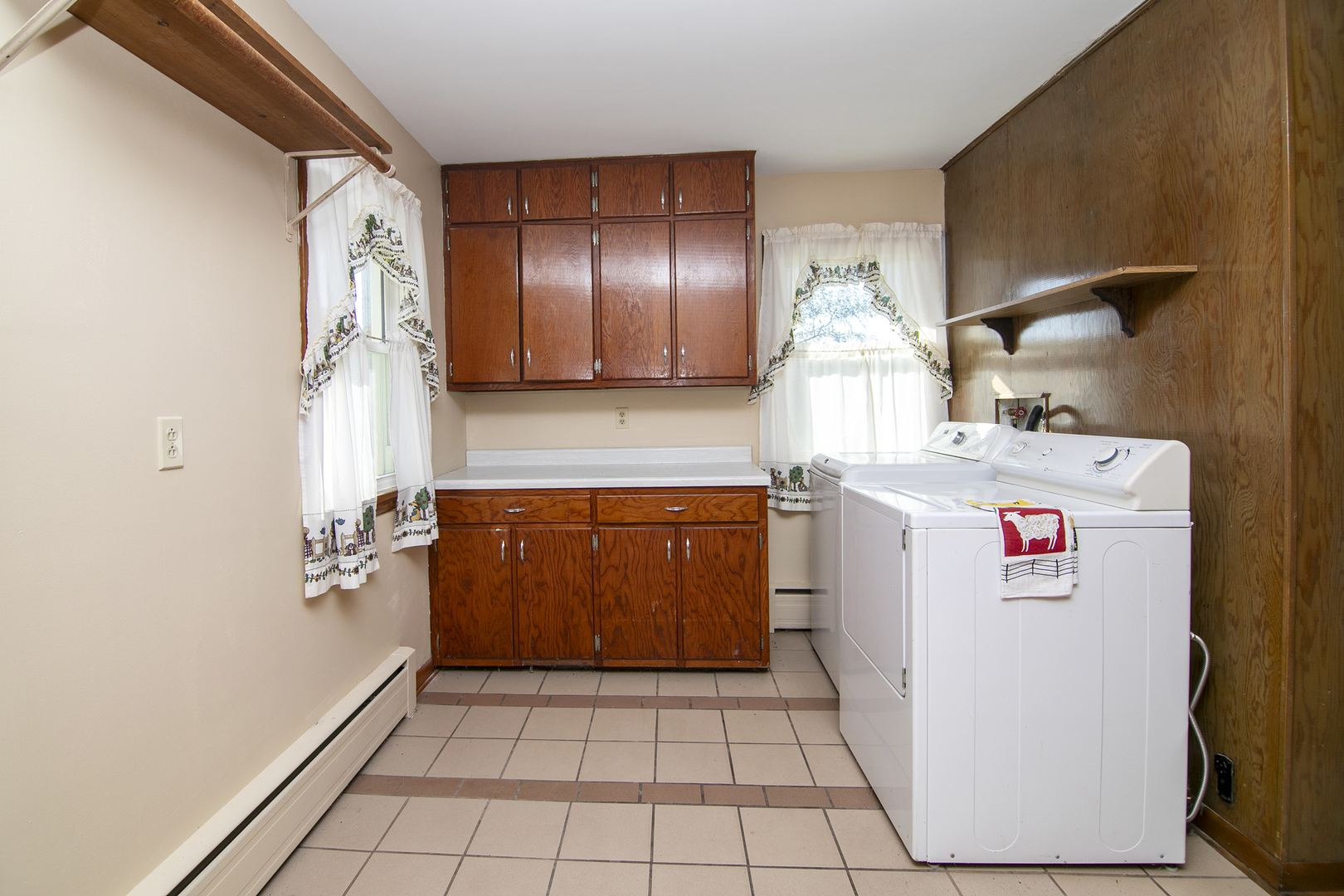 76 South 7000W Road Kankakee, IL 60901 - Photo 11 of 18 a utility room with cabinets washer and dryer