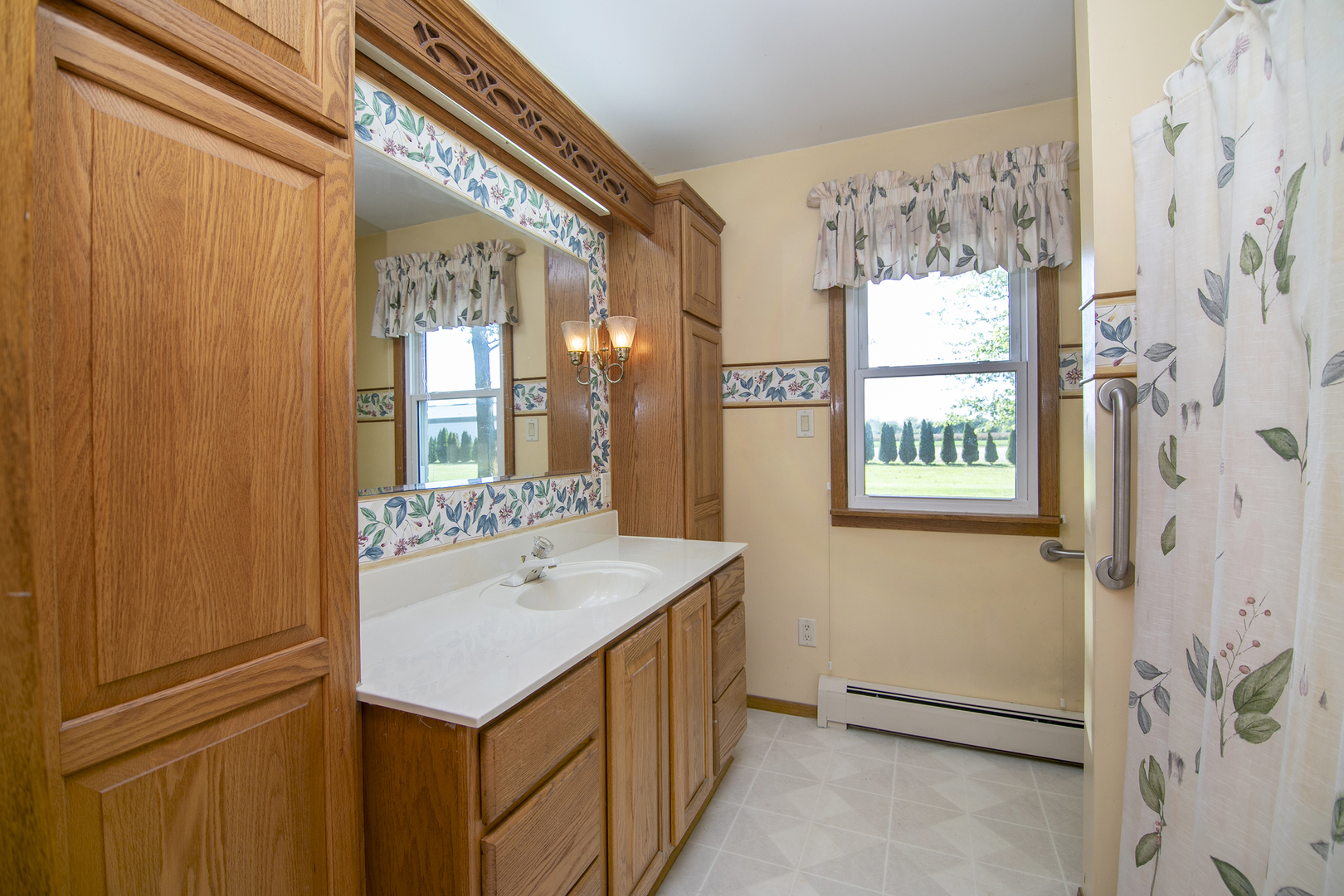 76 South 7000W Road Kankakee, IL 60901 - Photo 14 of 18 a bathroom with a sink and a mirror