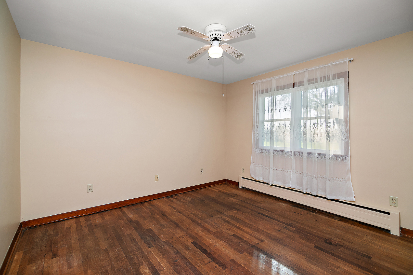 76 South 7000W Road Kankakee, IL 60901 - Photo 15 of 18 an empty room with wooden floor and windows