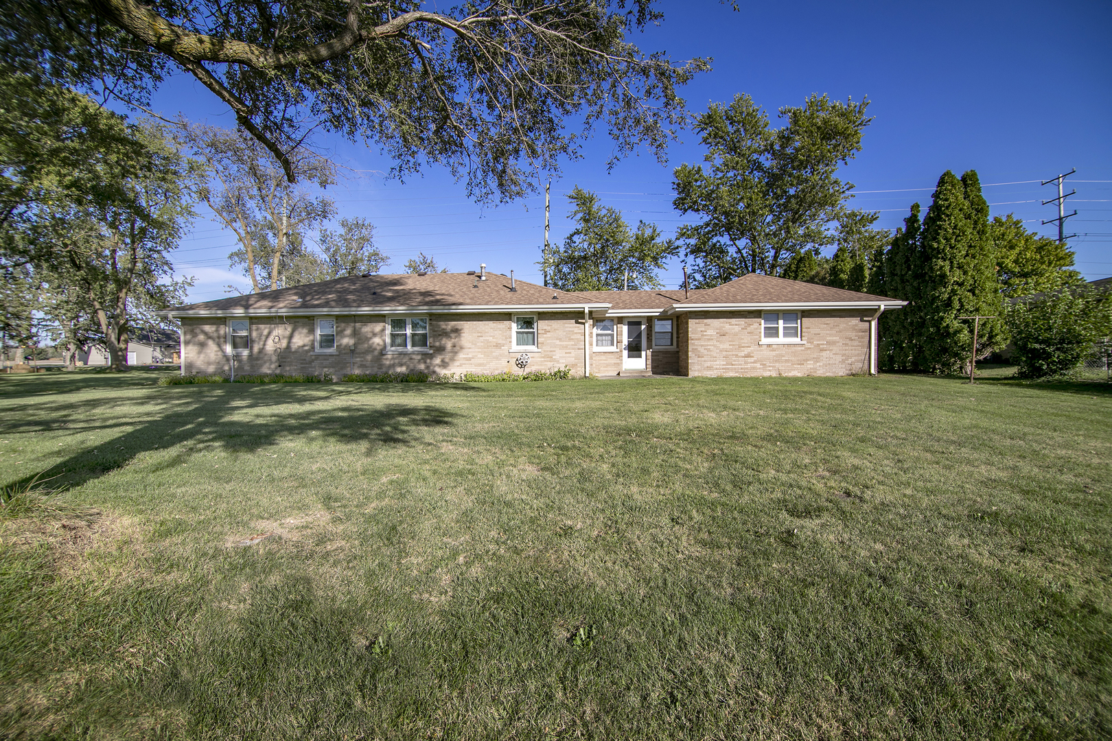 76 South 7000W Road Kankakee, IL 60901 - Photo 17 of 18 a view of a house with a big yard and a large tree