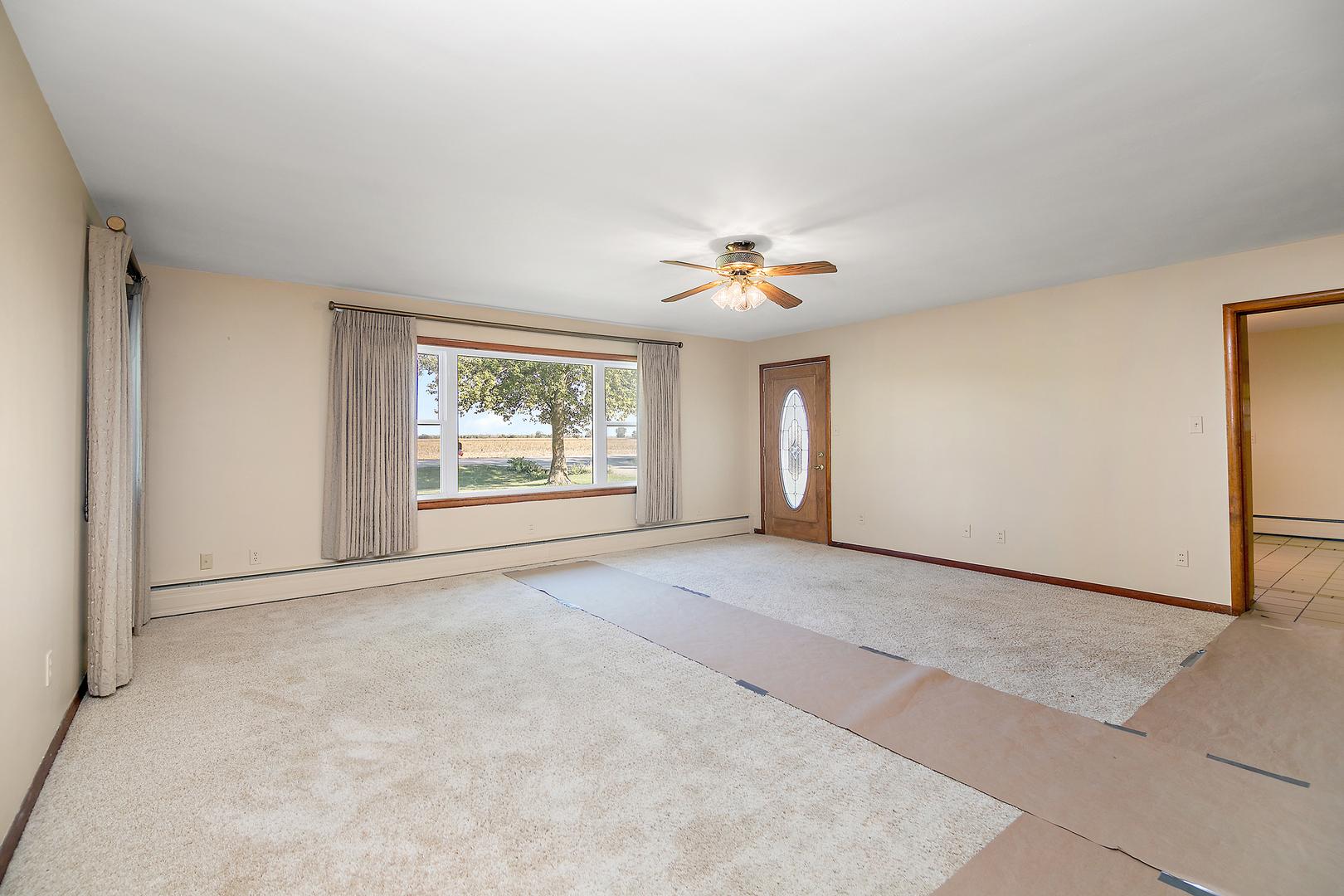 76 South 7000W Road Kankakee, IL 60901 - Photo 4 of 18 a view of an empty room with a window