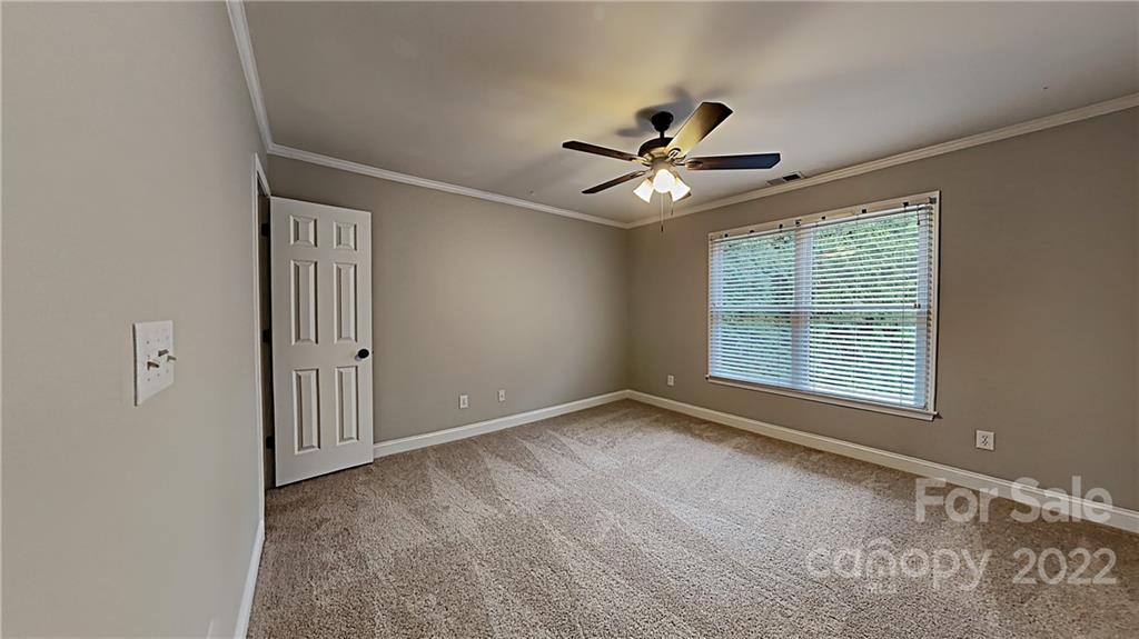 6415 Riverside Oaks Drive Huntersville, NC 28078 - Photo 11 of 22 a view of an empty room with a window