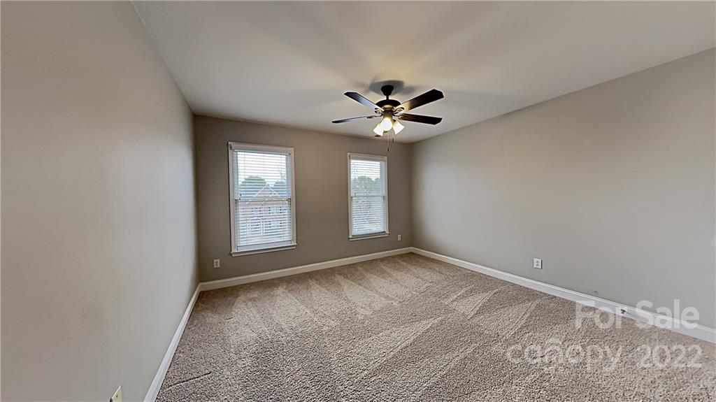 6415 Riverside Oaks Drive Huntersville, NC 28078 - Photo 12 of 22 a view of an empty room with a window