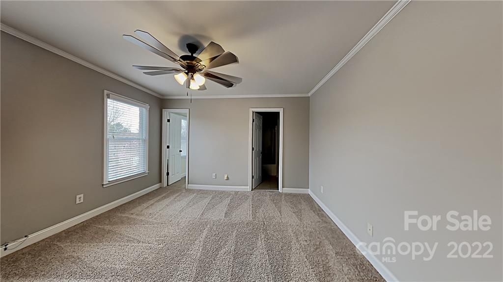 6415 Riverside Oaks Drive Huntersville, NC 28078 - Photo 13 of 22 a view of an empty room with a window