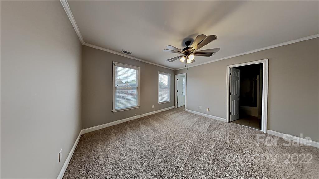 6415 Riverside Oaks Drive Huntersville, NC 28078 - Photo 14 of 22 a view of an empty room with a window