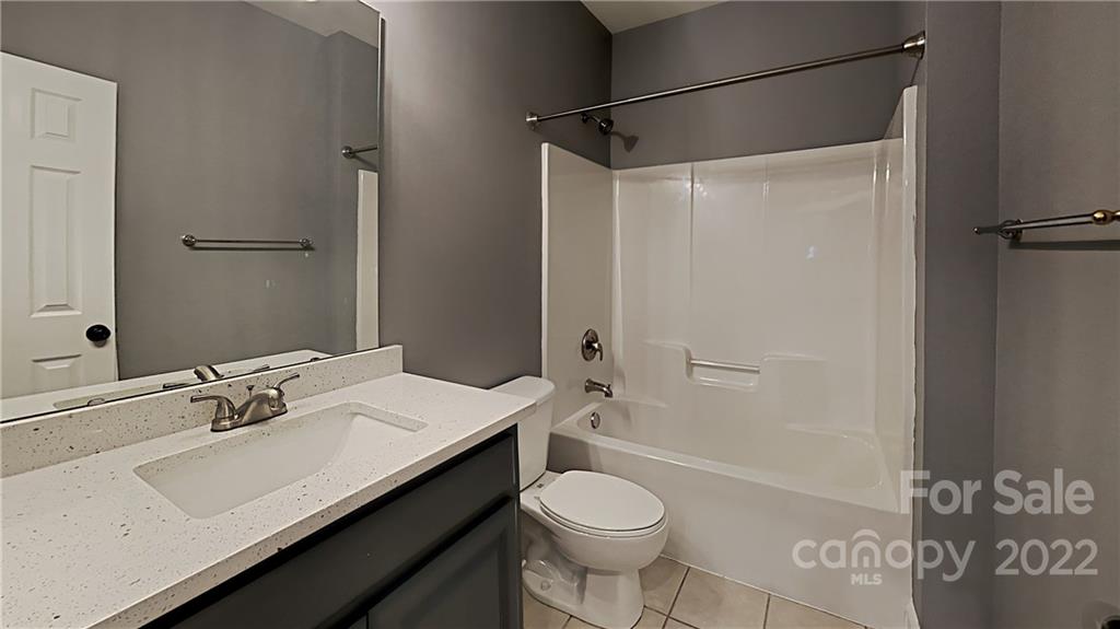 6415 Riverside Oaks Drive Huntersville, NC 28078 - Photo 16 of 22 a bathroom with a sink toilet vanity and shower
