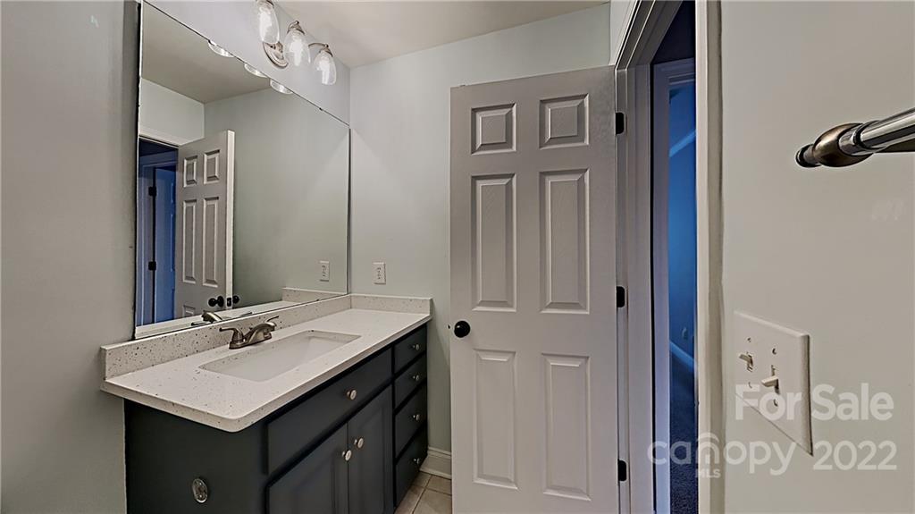 6415 Riverside Oaks Drive Huntersville, NC 28078 - Photo 17 of 22 a bathroom with a sink vanity and a mirror