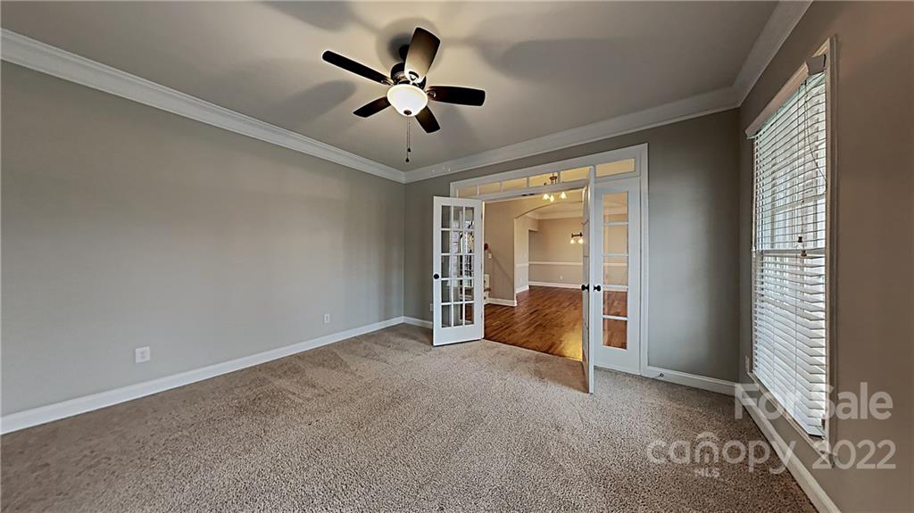 6415 Riverside Oaks Drive Huntersville, NC 28078 - Photo 19 of 22 a view of an empty room with a window