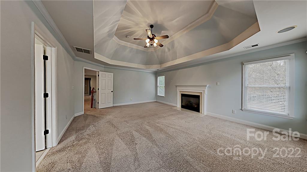 6415 Riverside Oaks Drive Huntersville, NC 28078 - Photo 6 of 22 a view of a livingroom with a ceiling fan window and a ceiling fan