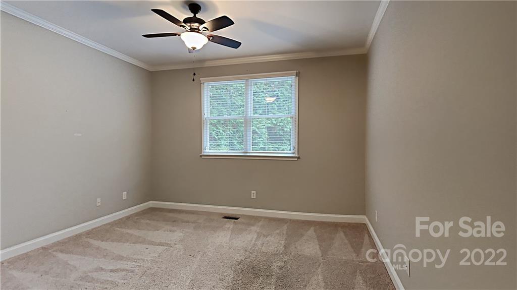 6415 Riverside Oaks Drive Huntersville, NC 28078 - Photo 9 of 22 a view of an empty room with a window