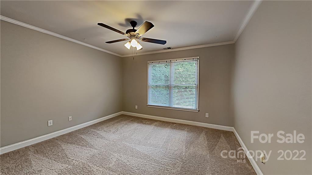 6415 Riverside Oaks Drive Huntersville, NC 28078 - Photo 10 of 22 a view of an empty room with a window