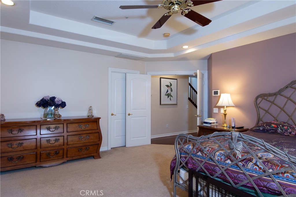 7361 Via Vista Riverside, CA 92506 - Photo 12 of 34 a bedroom with a bed and a chandelier